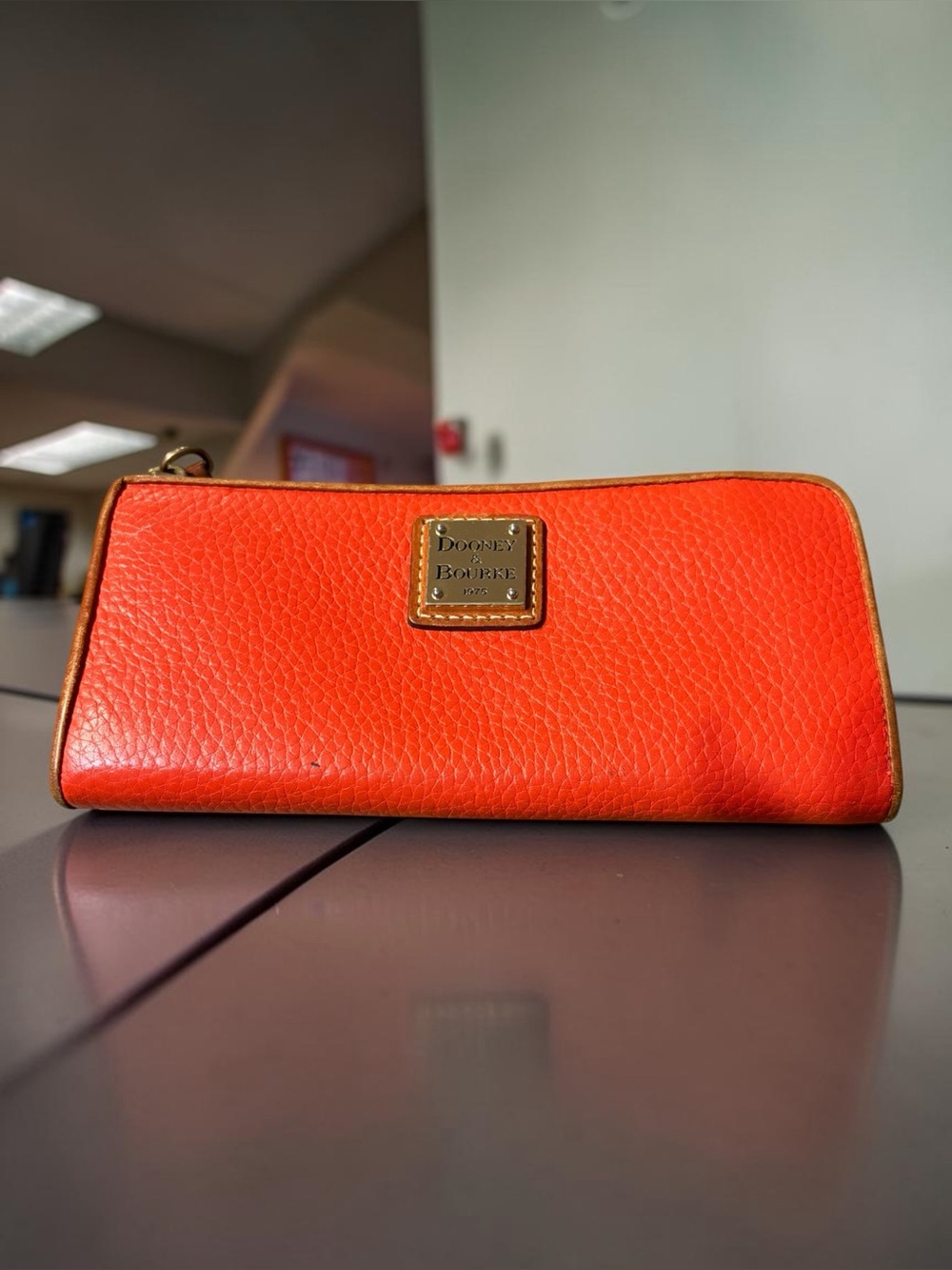 Dooney & Bourke Bright Orange Pebbled Leather Wristlet